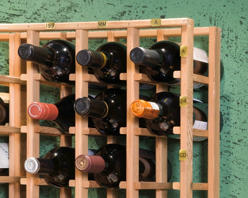 Mini-Locator Label on wine rack with bottles in grid against green wall