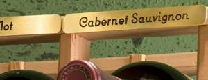 Small Varietal Label showing Cabernet Sauvignon on brass wine rack